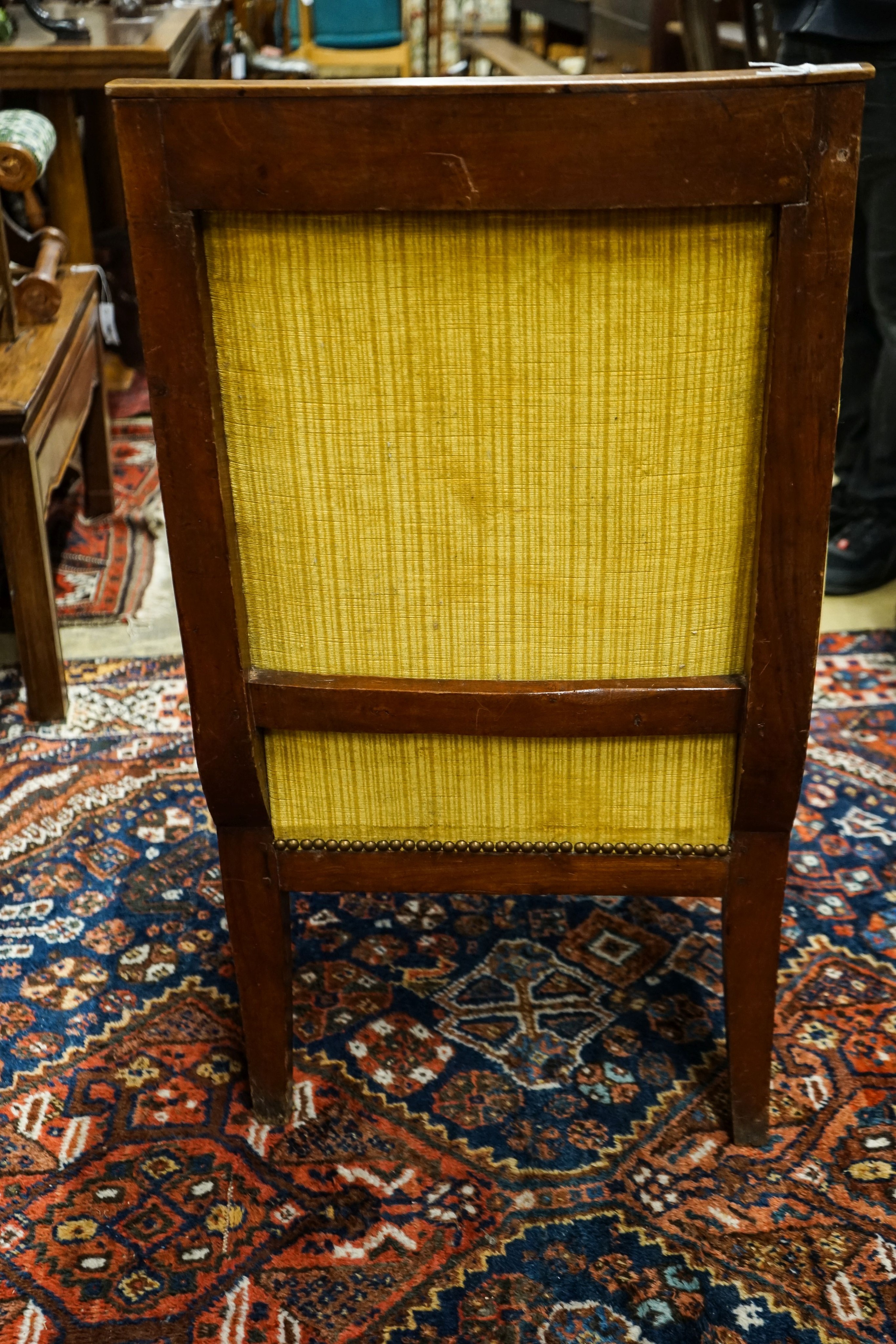 An Empire fruitwood bergere, c.1840, width 62cm, depth 52cm, height 90cm